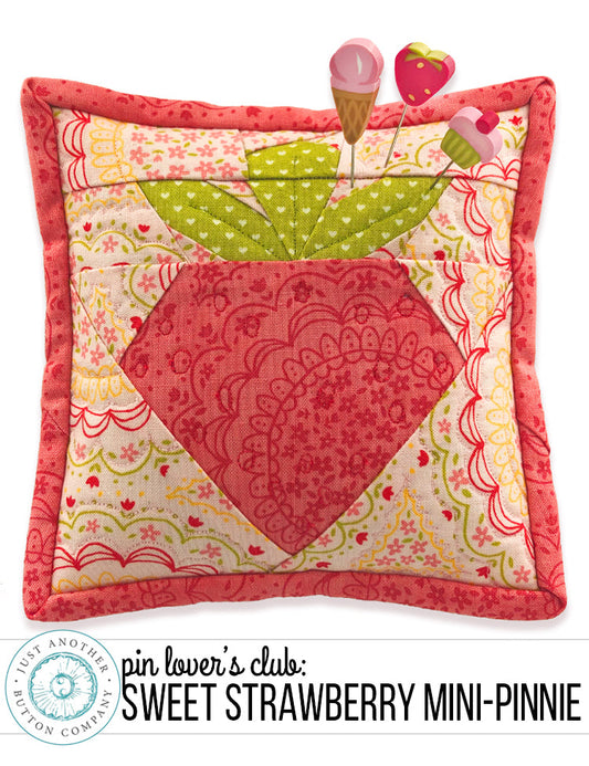 A handmade paper pieced pincushion pin cushion with a strawberry design, part of a limited edition 'Sweet Strawberry' pattern by Just Another Button Company.
Photo by JustAnotherButtonCompany.com [image_link]