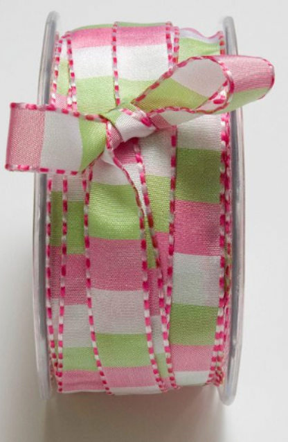A spool of ribbon with a pink, white, and light green plaid pattern and pink dashed edge trim, tied in a bow at the top.
Photo by Mayarts.com [additional_image_link]