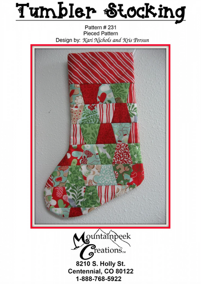A quilted Christmas stocking with a tumbler pattern design, featuring red, green, and various festive prints.
[image_link]