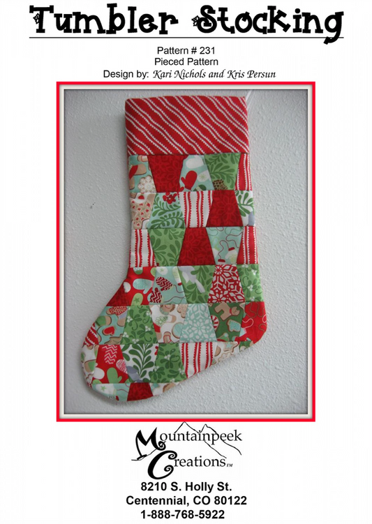 A quilted Christmas stocking with a tumbler pattern design, featuring red, green, and various festive prints.
[image_link]