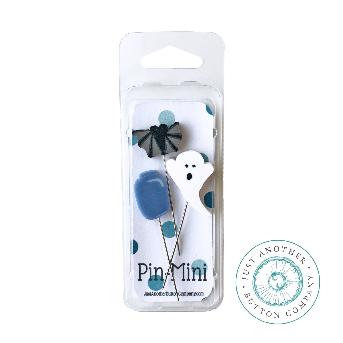 Pin-Mini pin set in a clear plastic blister pack, featuring a black bat, white ghost, blue jar pins. A circular logo for 'Just Another Button Company' is visible on the bottom right.
Photo by JABC [additional_image_link]