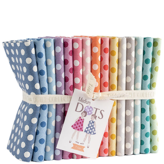 Set of colorful polka dot fabric bundles with a tag on a white background
Photo by Tildafabrics.com [image_link]