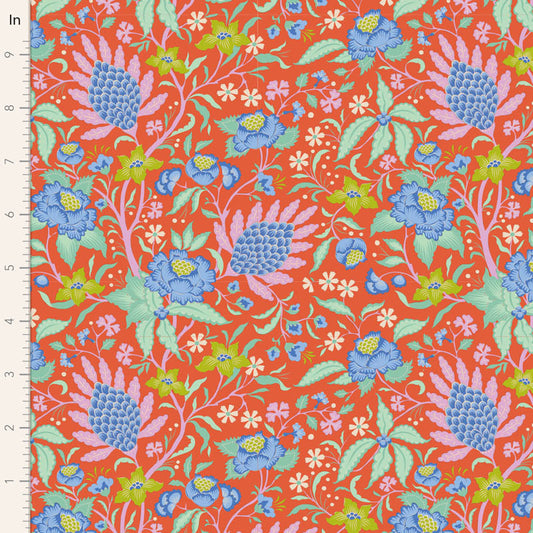A remnant piece of fabric featuring a floral pattern with a mix of orange, blue, and green colors on a persimmon background.
Photo by Tildafabrics.com [image_link]