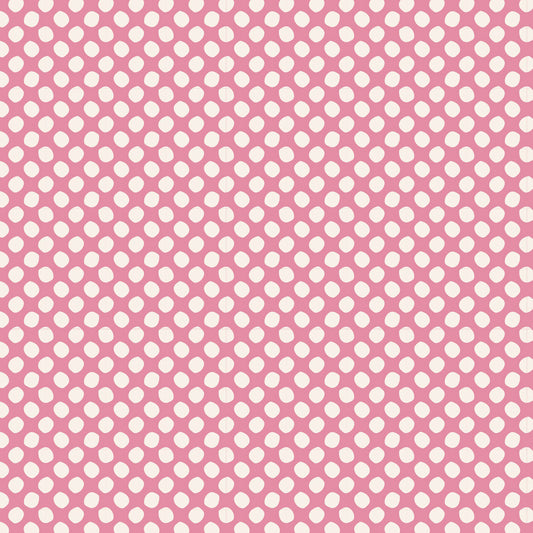A repeating pattern of small white oval dots on a pink background.
Photo by Tildafabrics.com [image_link]