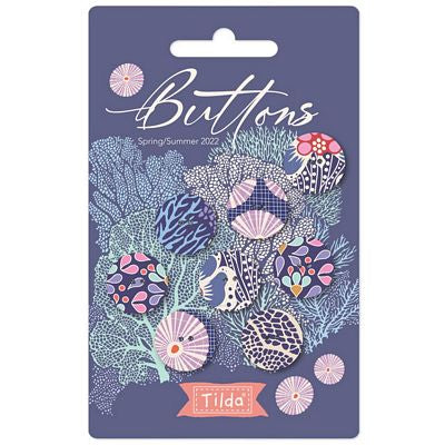Packaging of Tilda Cotton Beach Buttons featuring blue and pink patterned buttons with a floral and marine life design.
Photo by Tildafabrics.com [image_link]