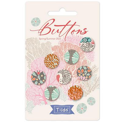 A retail package of Tilda brand buttons from their Spring/Summer 2022 collection. The packaging is a cream-colored card decorated with coral illustrations and the word 'Buttons' in red script.
Photo by Tildafabrics.com [image_link]