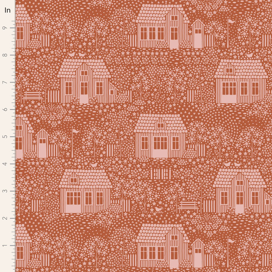 A fabric from the Tilda Hometown My Neighborhood Blenders Rust yardage collection, featuring a pattern of houses and trees in a rust-colored blend on an orange background.
Photo by Tildafabrics.com [image_link]