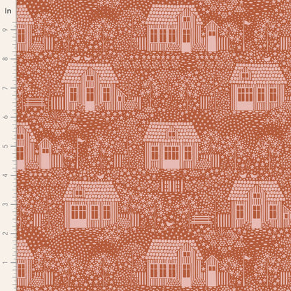 A fabric from the Tilda Hometown My Neighborhood Blenders Rust yardage collection, featuring a pattern of houses and trees in a rust-colored blend on an orange background.
Photo by Tildafabrics.com [image_link]