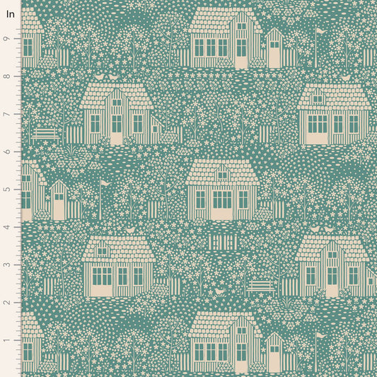 A repeating fabric pattern showing cream-colored cottages, trees, and flowers on a teal background, with a ruler scale along the left edge marked in inches.
Photo by Tildafabrics.com [image_link]