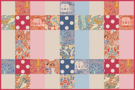 A quilted fabric panel featuring a patchwork grid of floral, polka dot, and house-patterned squares in pink, blue, red, and cream, framed by a solid red border.
Photo by Tildafabrics.com [image_link]