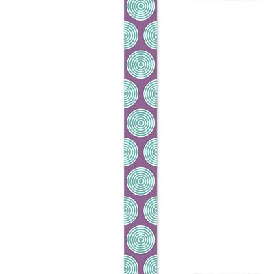 A narrow vertical ribbon featuring a repeating pattern of concentric light aqua circles on a muted purple background, centered against a plain white backdrop.
Photo by Tildafabrics.com [image_link]