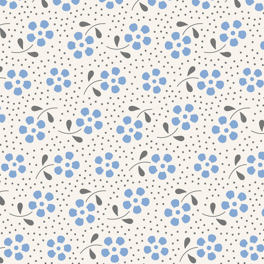 A repeating floral pattern featuring light blue flower clusters with small gray leaves and stems, set against a warm off-white background with fine gray polka dots.
Photo by Tildafabrics.com [image_link]