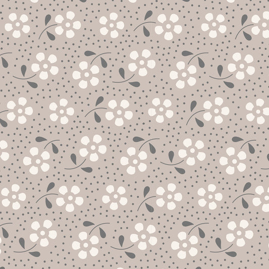 A repeating floral pattern on a warm taupe background, featuring cream-colored flower clusters with small dark gray leaves and stems, plus scattered dark gray dots.
Photo by Tildafabrics.com [image_link]