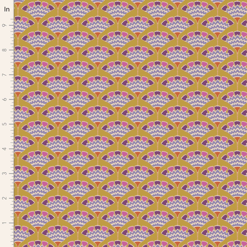 A close-up of a repeating fabric or wallpaper pattern with a mustard yellow background, scalloped fan motifs in pink, purple, and white, and a white ruler along the left edge marked in inches.
Photo by Tildafabrics.com [image_link]