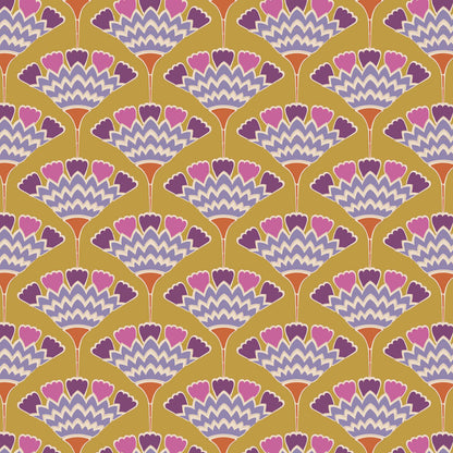 A close-up of a repeating fabric or wallpaper pattern with a mustard yellow background, scalloped fan motifs in pink, purple, and white.
Photo by Tildafabrics.com [additional_image_link]