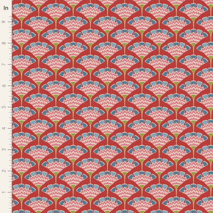 Yardage of Pie in the Sky Tasselflower Red fabric featuring a floral pattern with red, blue, and green colors on a cotton material.
Photo by Tildafabrics.com [image_link]
