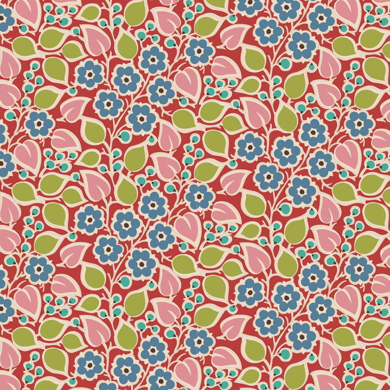 A close-up of a repeating floral patterned fabric or wallpaper sample with a ruler scale on the left edge. The pattern features pink flowers with blue centers and green leaves on a coral-red background.
Photo by Tildafabrics.com [additional_image_link]
