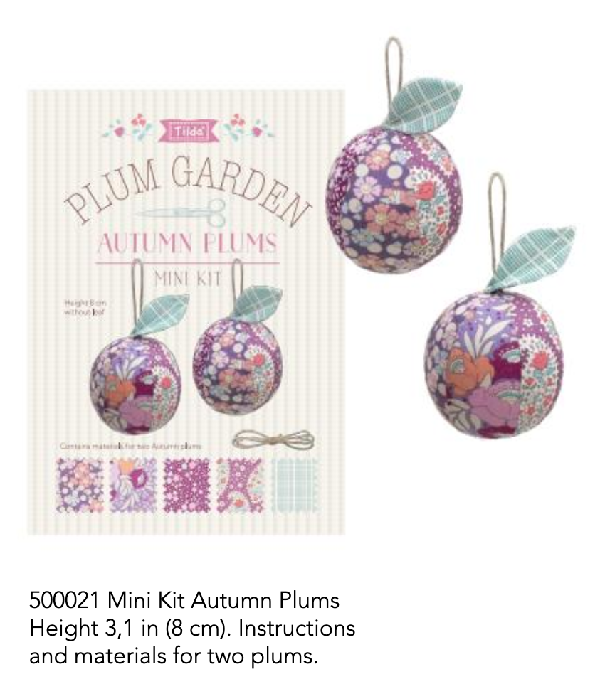 Packaging of 'Tilda Plum Garden Autumn Plums Mini Sewing Kit' featuring images of two round pincushion toys with a floral pattern, alongside a fabric and a needle, against a white background.
Photo by Tildafabrics.com [image_link]