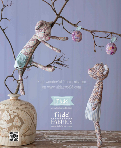 Stuffed bears with plums hanging from a tree.
Photo by Tildafabrics.com [additional_image_link]