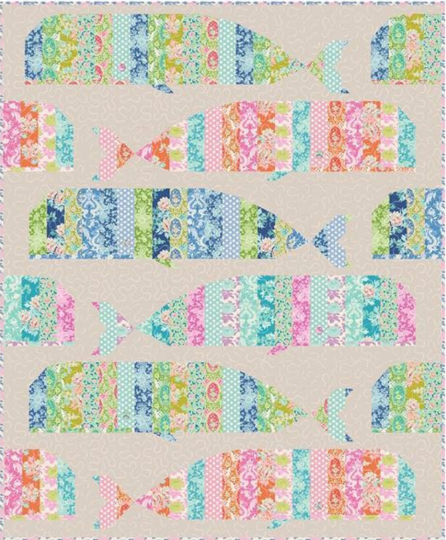Whale quilt pattern cover featuring a colorful patchwork quilt with whale shapes on a beige background.
Photo by Tildafabrics.com [additional_image_link]