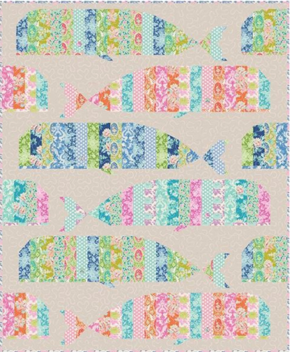 Whale quilt pattern cover featuring a colorful patchwork quilt with whale shapes on a beige background.
Photo by Tildafabrics.com [additional_image_link]