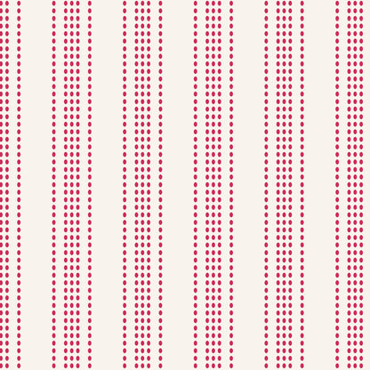 A repeating vertical stripe pattern featuring dense columns of small red dots on a warm off-white background.
Photo by Tildafabrics.com [additional_image_link]
