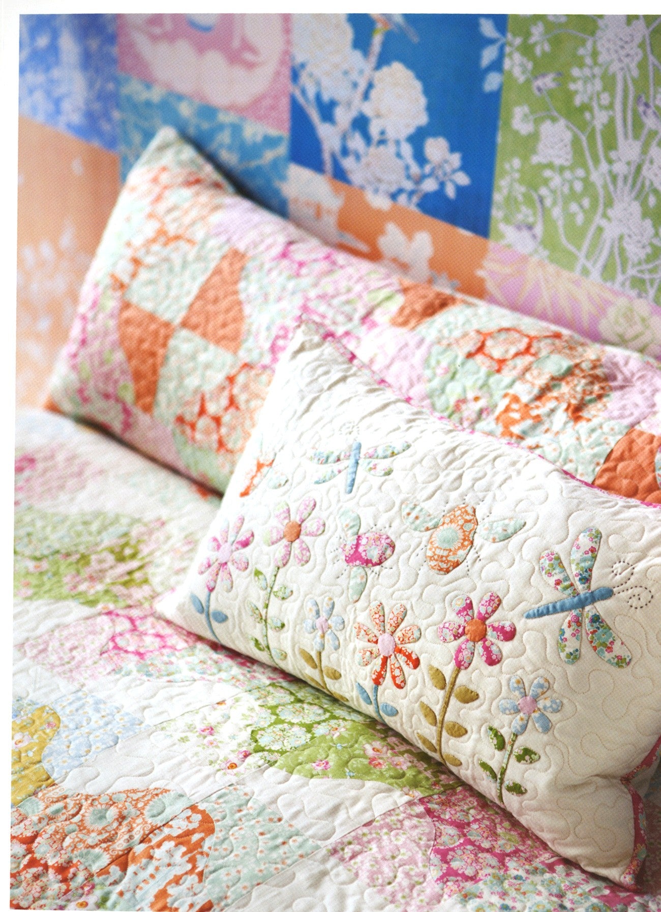 Floral quilt and pillows on a bed with colorful floral patterns in the background
Photo by Tildafabrics.com [additional_image_link]
