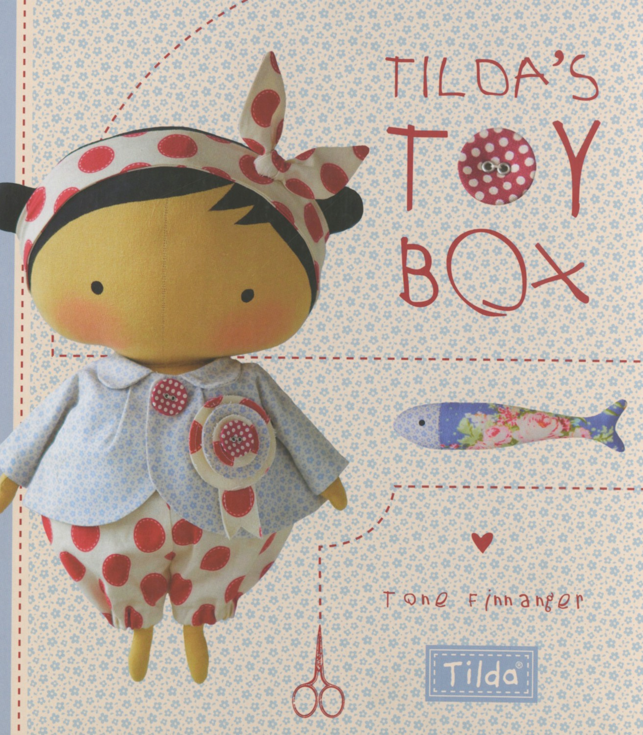 Front cover of the book 'Tilda's Toy Box' by Tine Finnger, featuring a soft fabric doll with a polka-dot headscarf and matching outfit on a patterned cream background with red stitched-line illustrations.
Photo by Tildafabrics.com [image_link]
