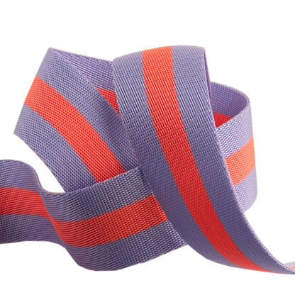 A spool of Tula Pink striped Nylon Webbing in lavender and neon peach colors, used for sewing and crafting.
Photo by RenaissanceRibbons.com [image_link]